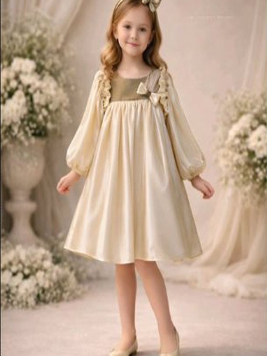 Girl in a cream occasion dress