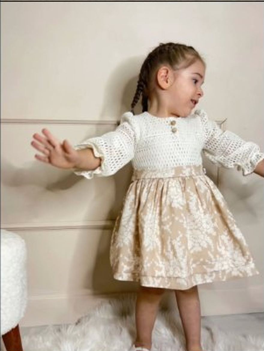 Toddler in a brocade dress